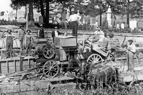 First portable concrete mixer pouring wall of Olin Cemetery